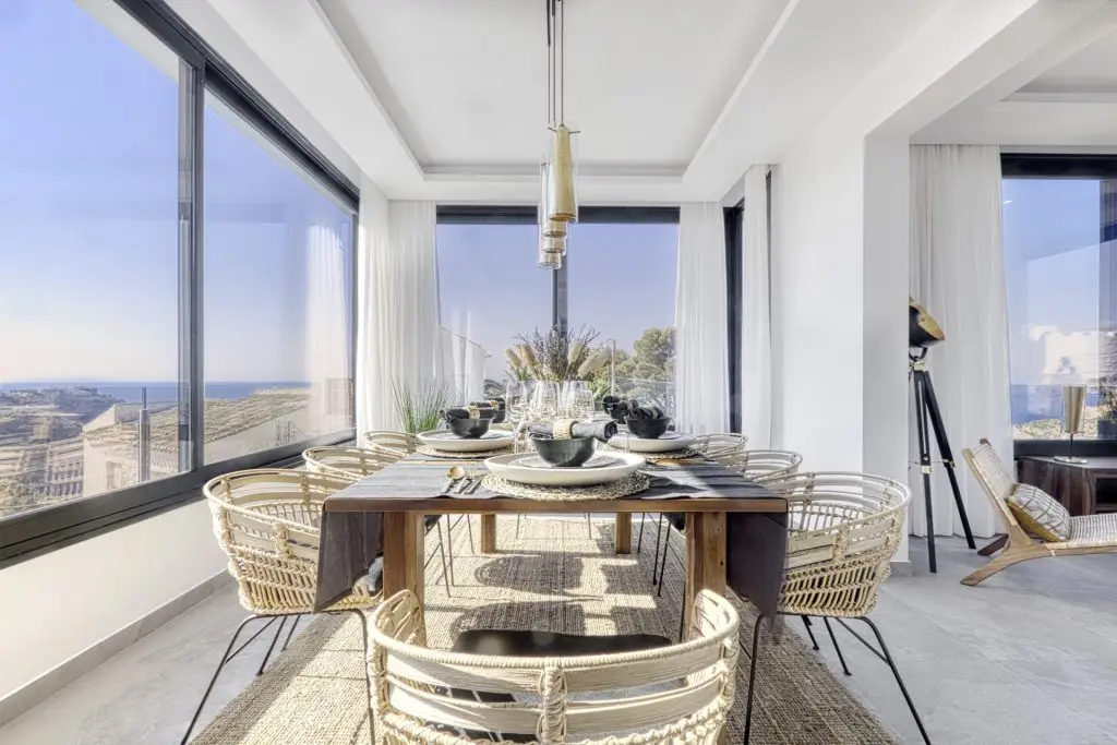 Elegant dining area with panoramic sea views in a luxury villa in Javea, Costa Blanca.