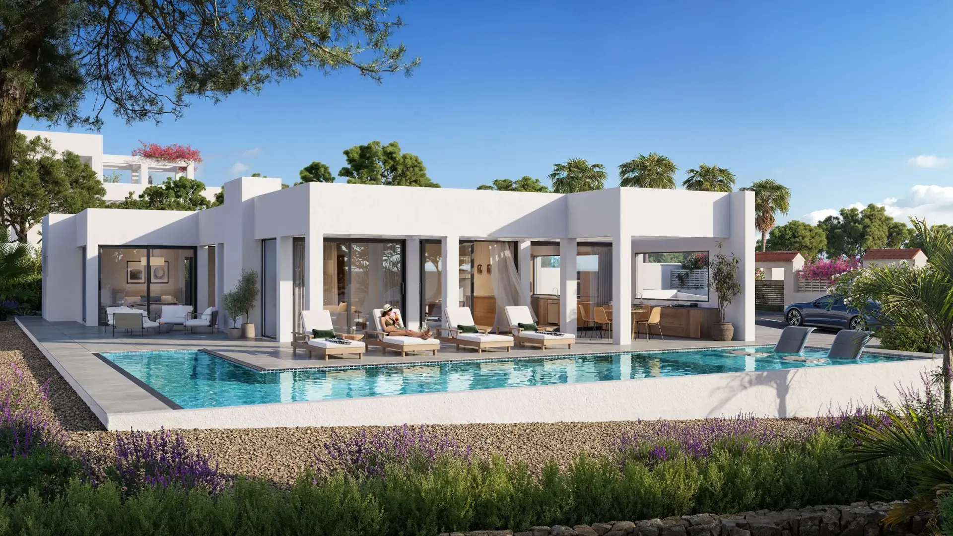 Modern luxury villa with a private pool, surrounded by Mediterranean landscaping in Javea, Spain.